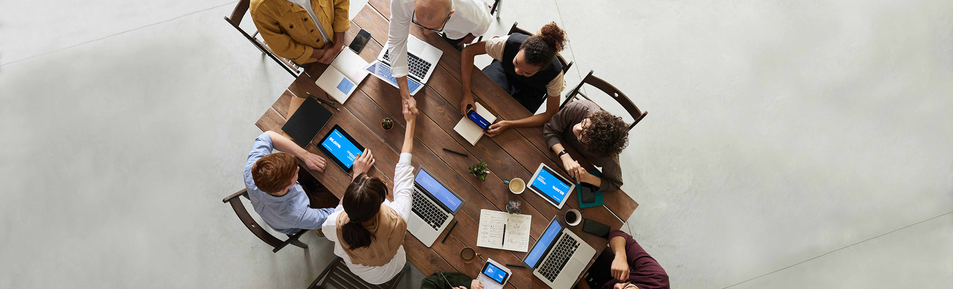 Image depicting friends using laptops in a social setting